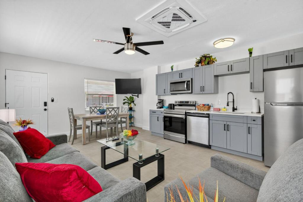 a living room with a couch and a kitchen at Park Shores Suites Unit 9 in St Pete Beach