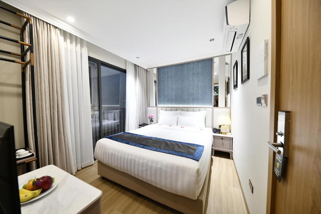 Ένα ή περισσότερα κρεβάτια σε δωμάτιο στο Dong Xuan Boutique Hotel