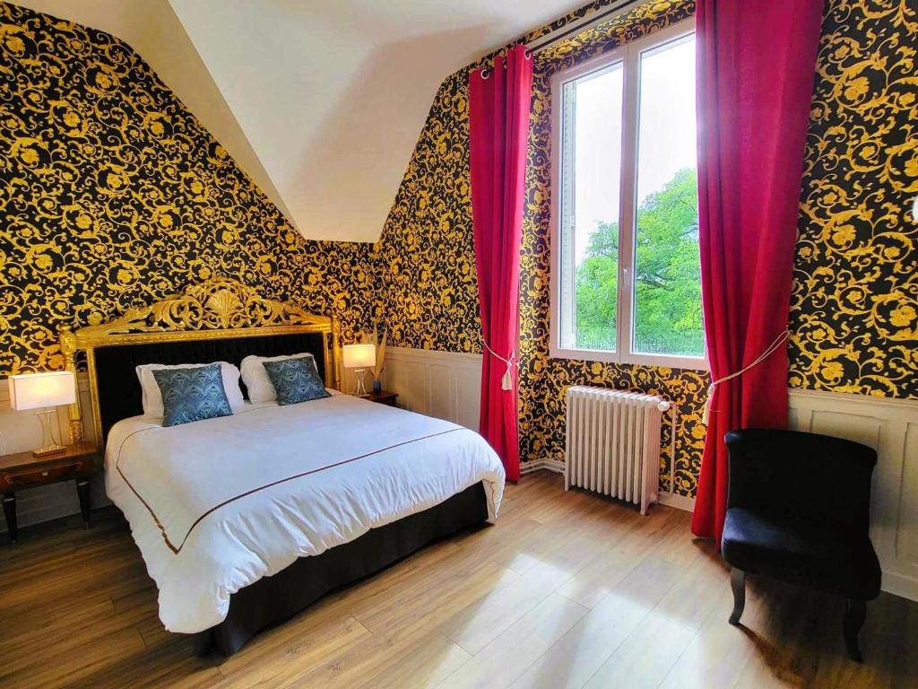a bedroom with a bed with red curtains and a window at Chambre Royale au Château de la Rose avec Parking Privé - FR-1-591-766 in Cluis