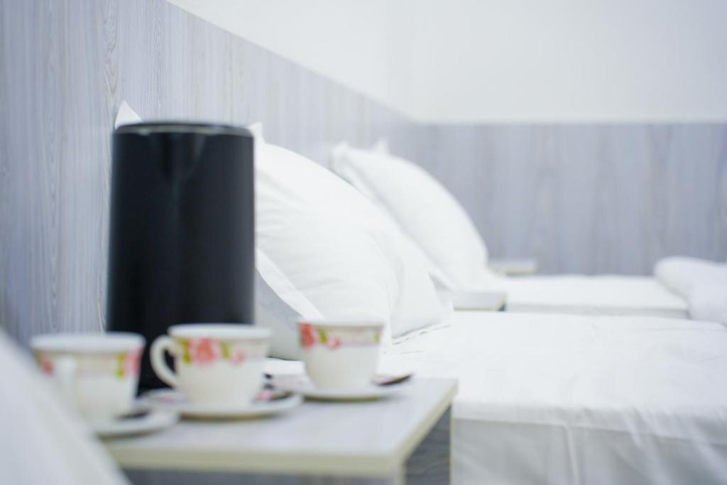 Ένα ή περισσότερα κρεβάτια σε δωμάτιο στο Chehran Hotel