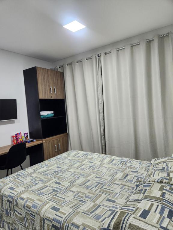 En eller flere senge i et værelse på West Fit Padrão - Apartamento 516