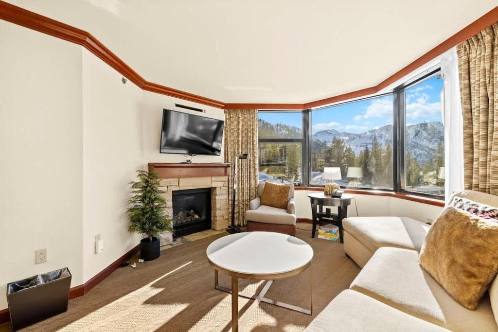 a living room with a couch and a fireplace at 6th Floor Fireplace Suite in Tahoe City