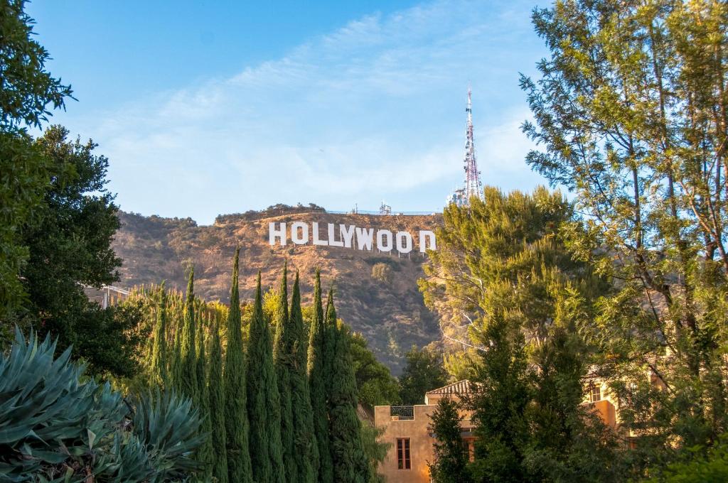a hollywood sign on top of a mountain at The Hotel Hollywood in Los Angeles