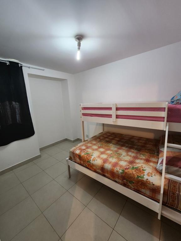 Una cama o camas en una habitación de Cittá Residence 3 academia piscina