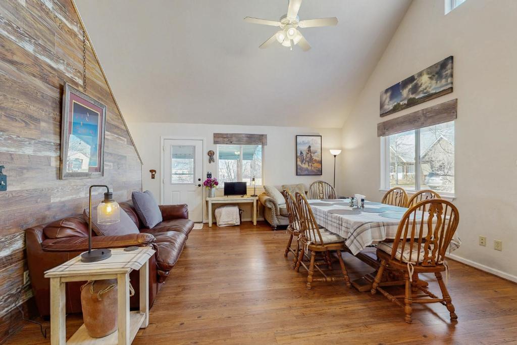 a living room with a table and a couch at Recreational Paradise in Gunnison