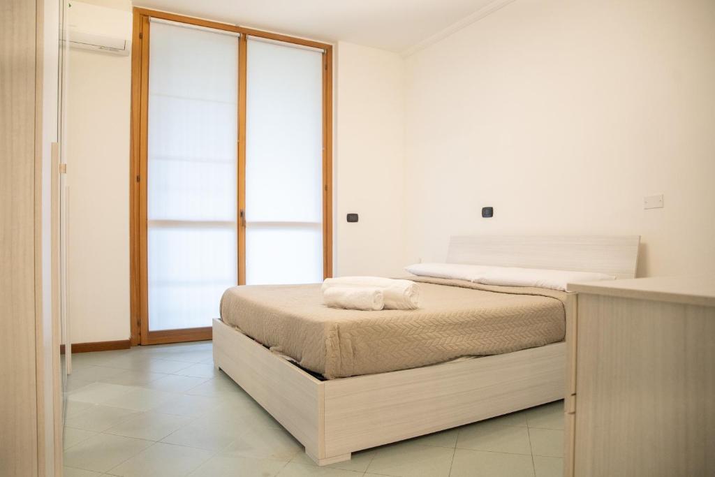 En eller flere senge i et værelse på Nicolò House