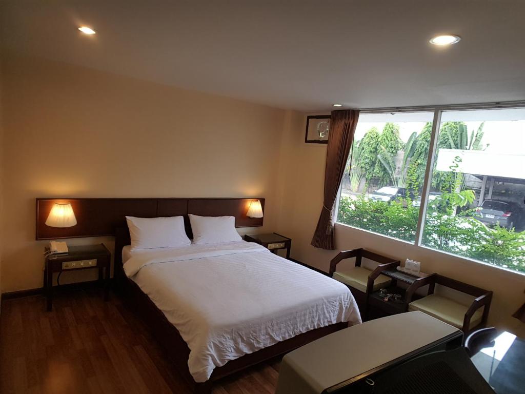 Posteľ alebo postele v izbe v ubytovaní Dusit Hotel