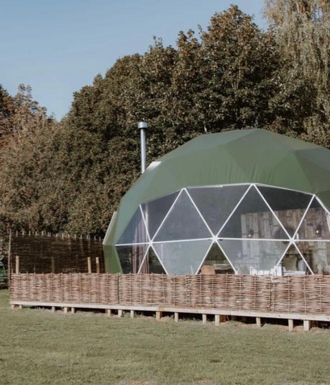 a large tent in a field next to a fence at Star Gazing Dome 2 with Log Burner & Optional Hot tub in Horspath