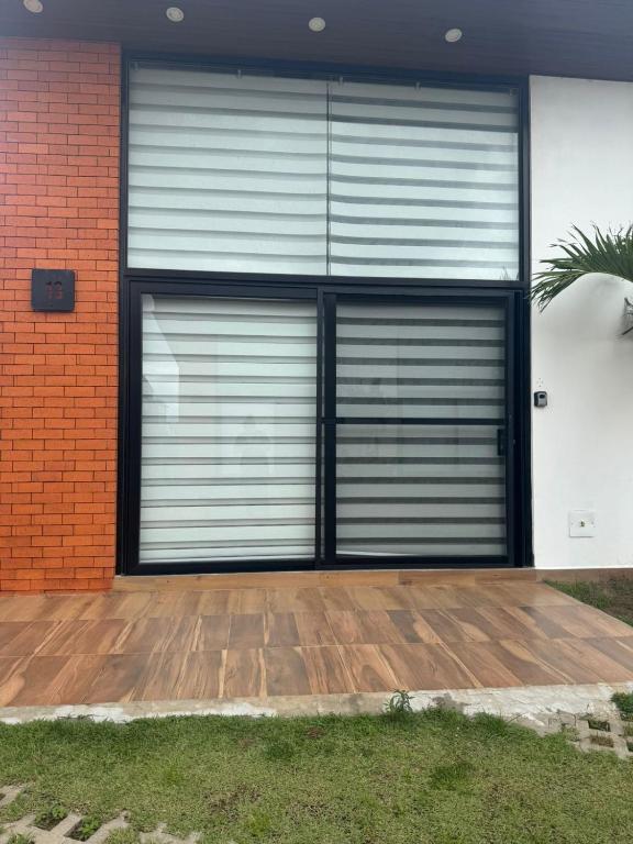 a pair of garage doors on the side of a house at Mar Adentro Casa 13 in Santa Cruz de la Sierra
