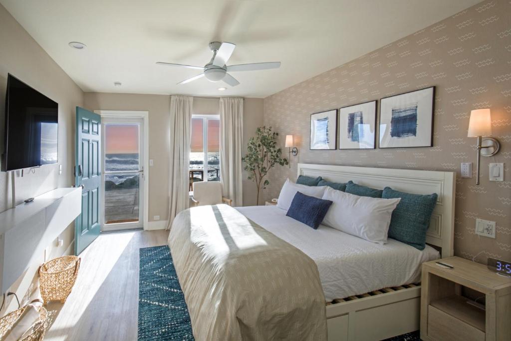 a bedroom with a bed and a ceiling fan at Black Sands Inn in Whitethorn