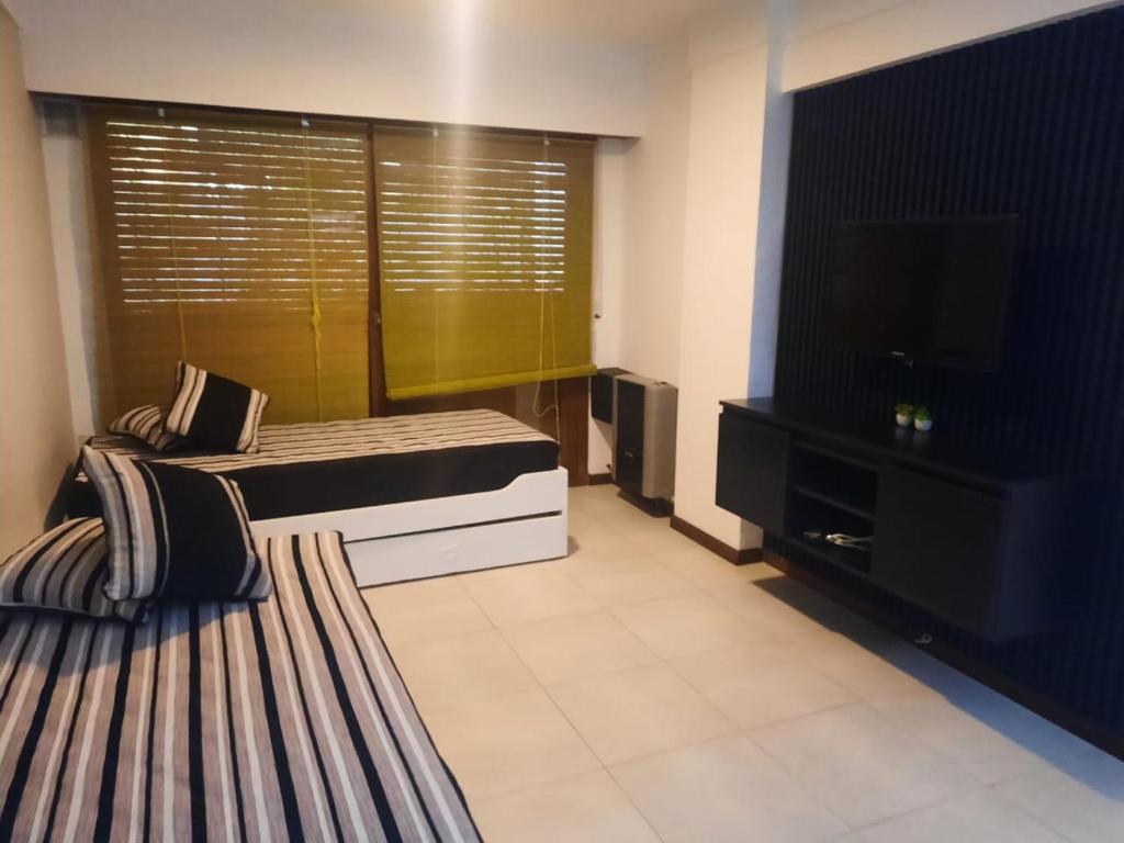 Ένα ή περισσότερα κρεβάτια σε δωμάτιο στο Constitucion2G