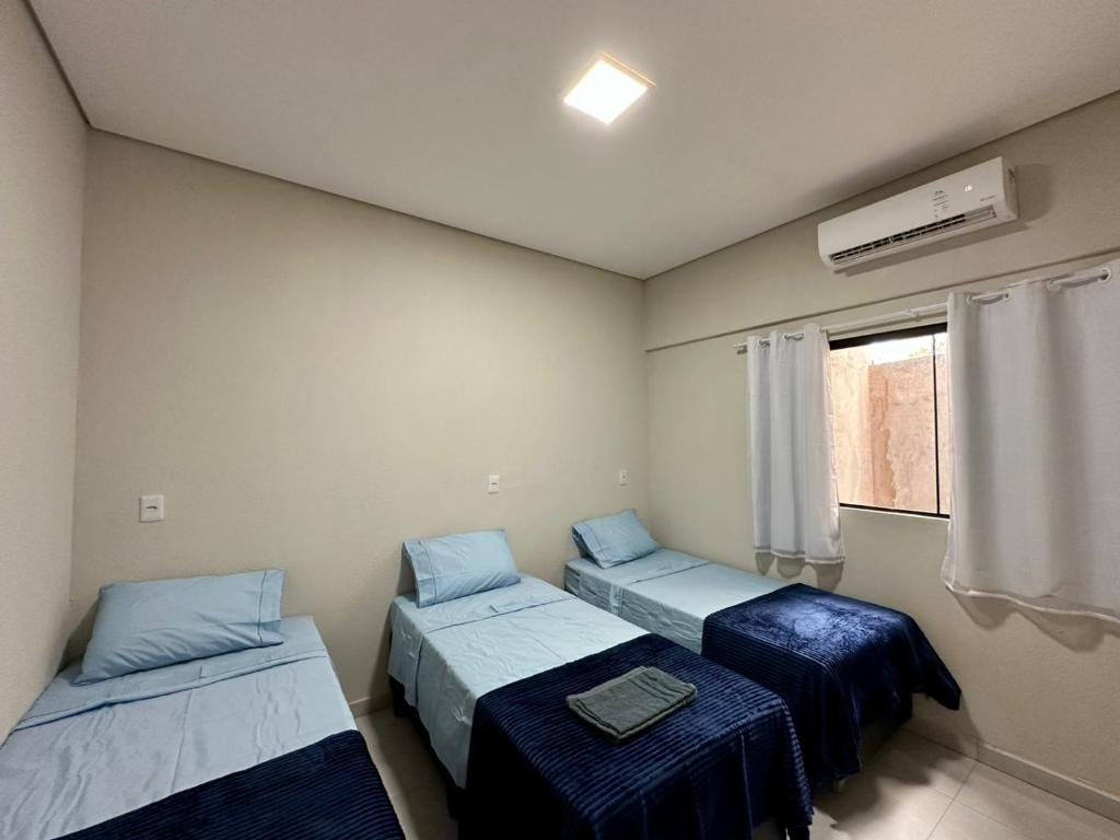 Ένα ή περισσότερα κρεβάτια σε δωμάτιο στο Hotel União Centro