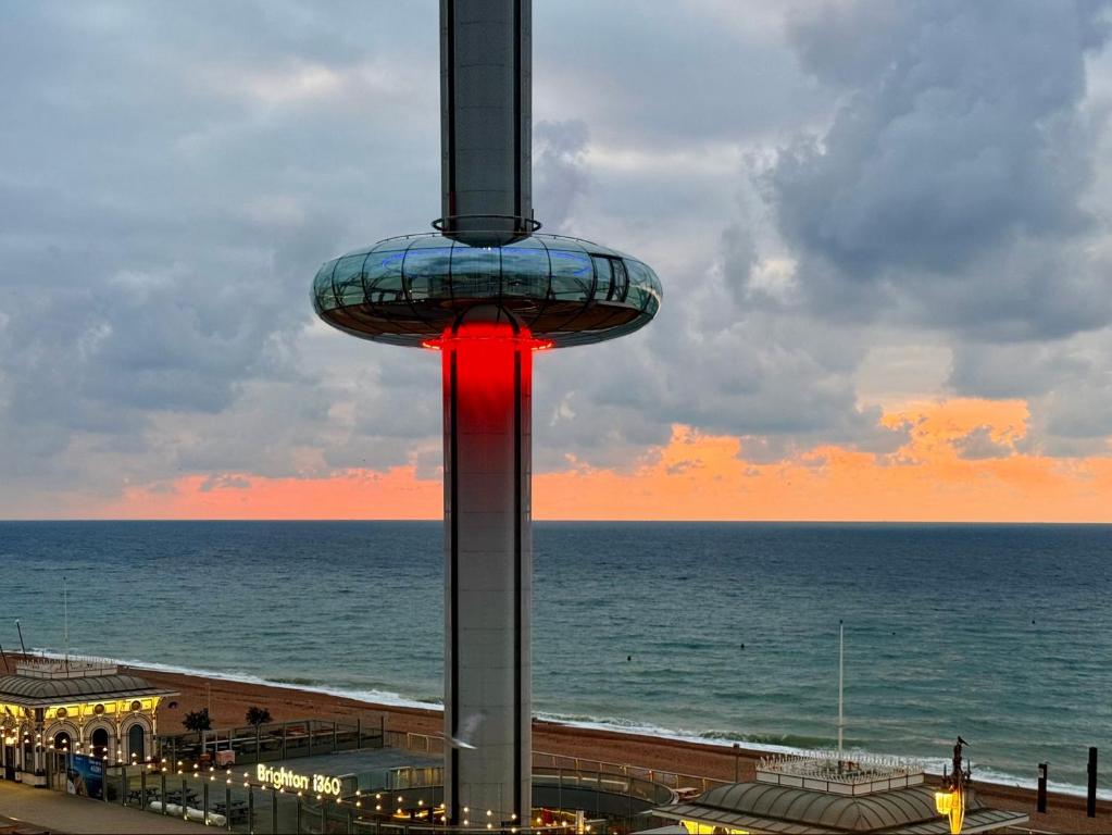 a view of the space needle in front of the ocean at Preston Street Apartments - by the Brighton i360 in Brighton & Hove