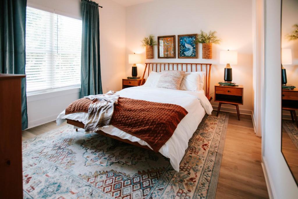 a bedroom with a large bed and a window at Mid-Term Discounts - Near Downtown, UGA, Hospital in Athens