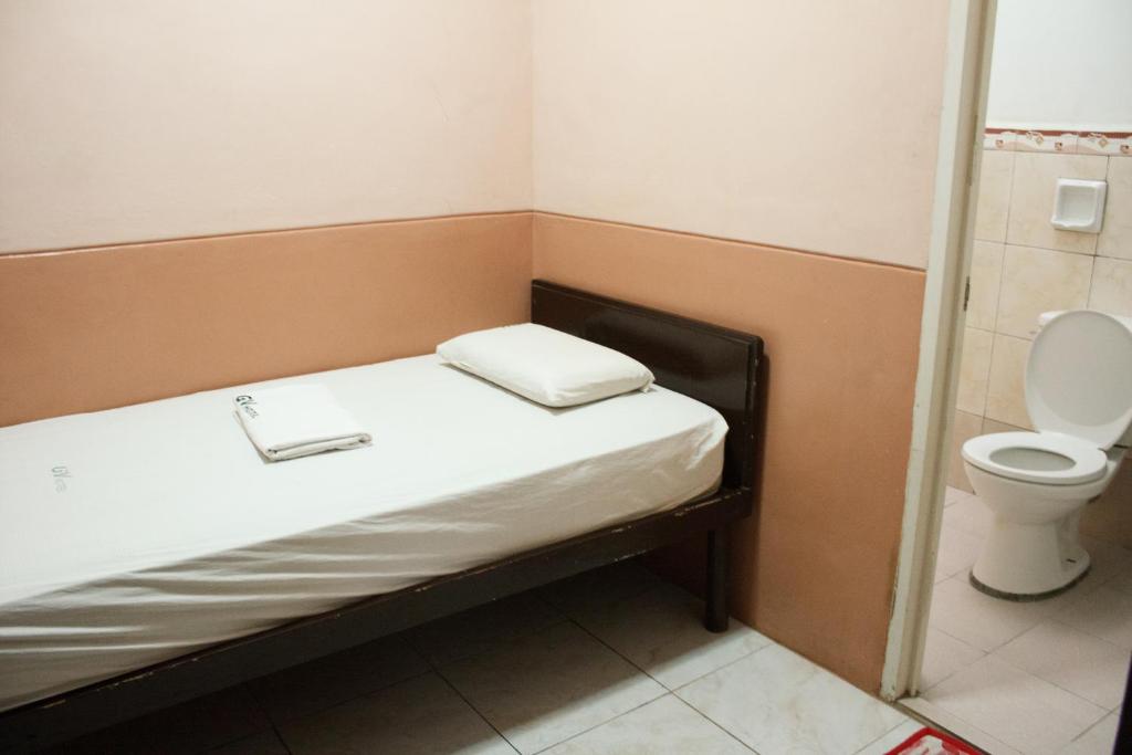 Postel nebo postele na pokoji v ubytování GV Hotel - Baybay