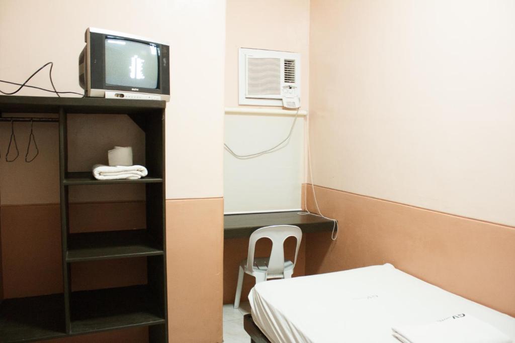 Postel nebo postele na pokoji v ubytování GV Hotel - Baybay