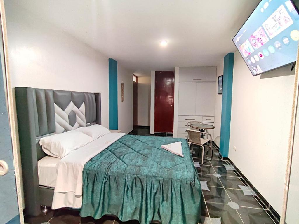 Postel nebo postele na pokoji v ubytování Hotel El Arizal Paracas