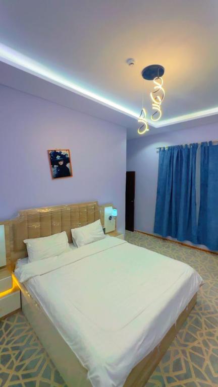 Postel nebo postele na pokoji v ubytování منتجع سيتي لاند 2