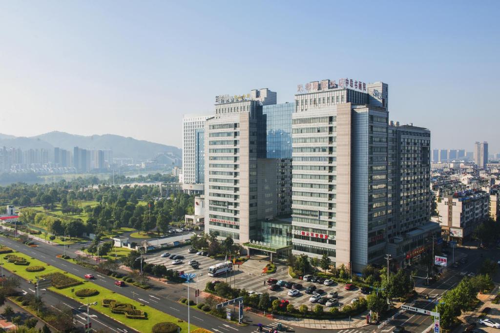 an aerial view of a city with tall buildings at Huangshan Tiandu International Hotel in Huangshan