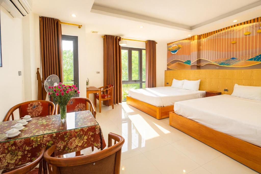 Postel nebo postele na pokoji v ubytování Tam Cốc Serenity Hotel