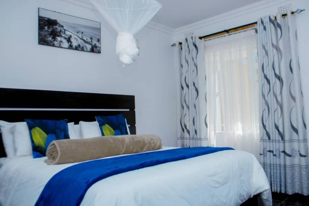 Ένα ή περισσότερα κρεβάτια σε δωμάτιο στο New Dawn Lodge