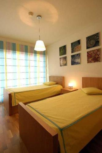 Postel nebo postele na pokoji v ubytování Orada Apartamentos Turísticos - Marina de Albufeira