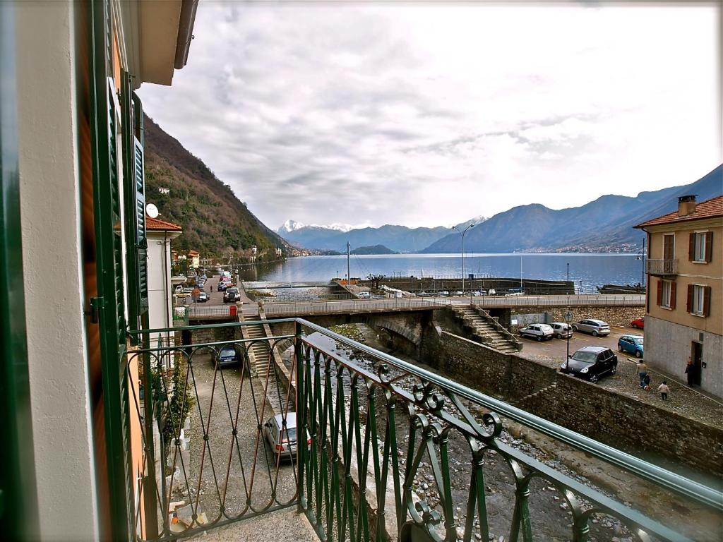 a balcony with a view of a body of water at Locanda Posta in Argegno
