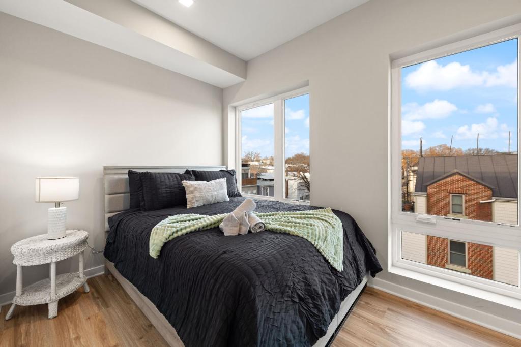 a bedroom with a bed with a stuffed animal on it at Union Market Lux 2BD Condo in Washington
