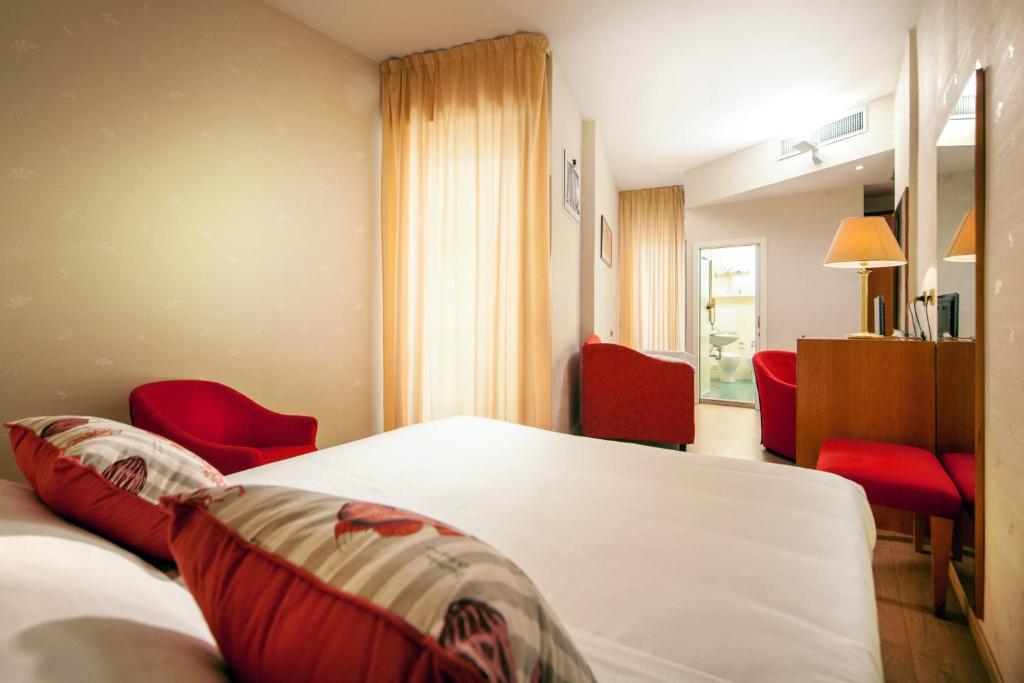Postel nebo postele na pokoji v ubytování Hotel Kursaal
