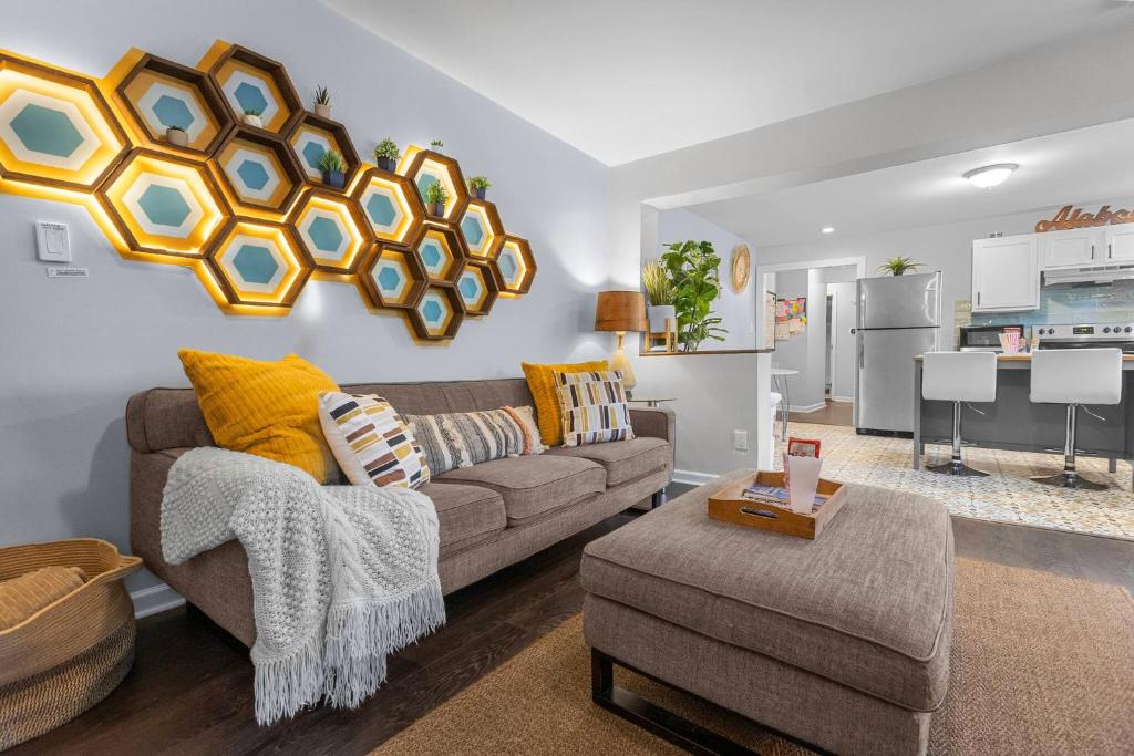 a living room with a couch and a table at *Super close to Hospitals|UAB|Open fl plan|2 bdr in Birmingham
