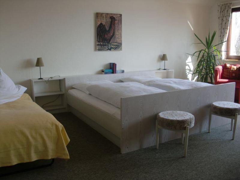 Postel nebo postele na pokoji v ubytování Hotel Spitze Warte