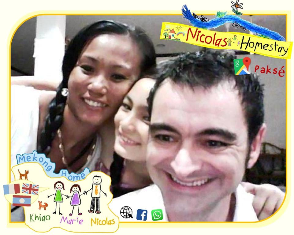 a man and a woman posing for a picture at Nicolas Homestay Mekong Home in Pakse