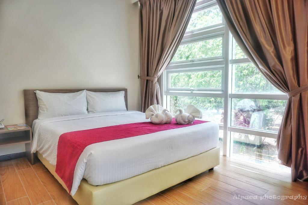 Postel nebo postele na pokoji v ubytování Nex Hotel Johor Bahru