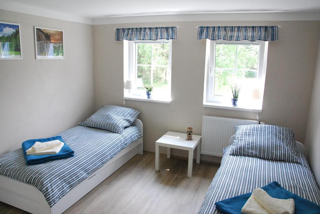 Postel nebo postele na pokoji v ubytování Apartment Ptačí Dům