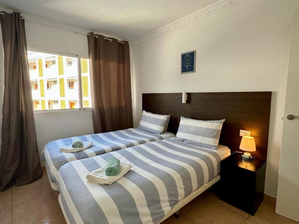 Ένα ή περισσότερα κρεβάτια σε δωμάτιο στο San Agustin Ocean View