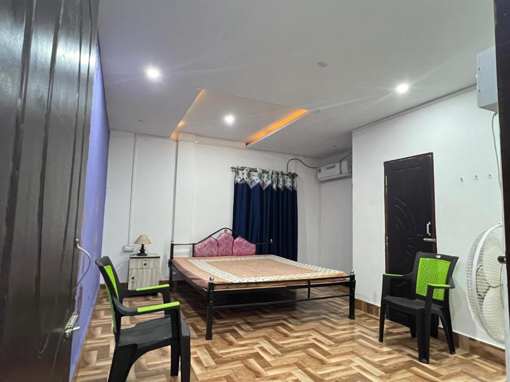 Ένα ή περισσότερα κρεβάτια σε δωμάτιο στο Samriddhi home stay