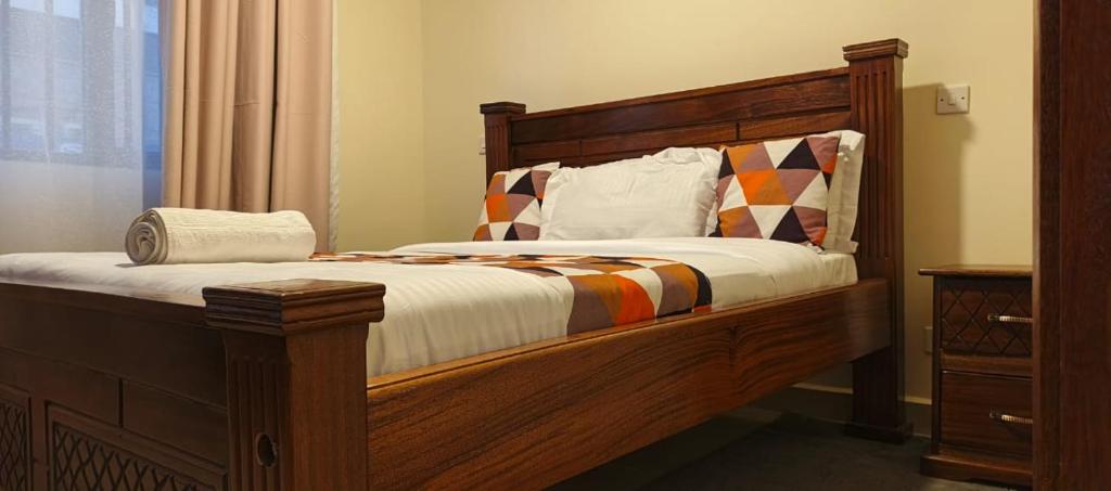 Postel nebo postele na pokoji v ubytování Ebony 1br Nanyuki town