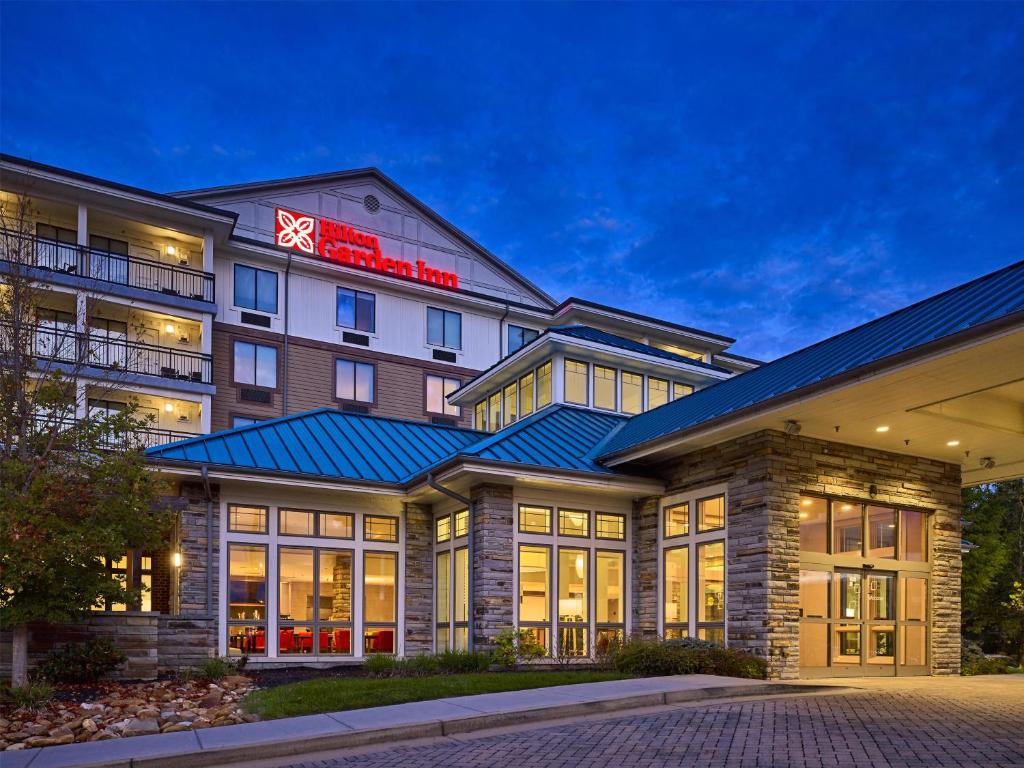 a rendering of a hotel at night at Hilton Garden Inn Pigeon Forge in Pigeon Forge