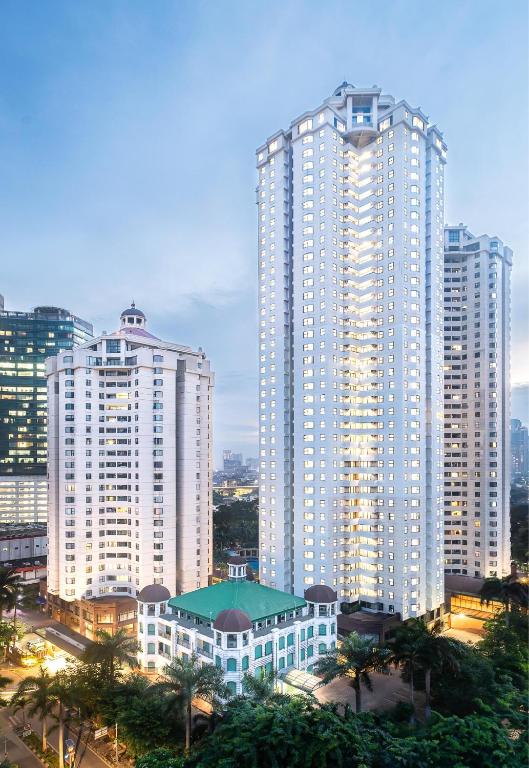 a group of tall buildings in a city at Aryaduta Suite Semanggi in Jakarta