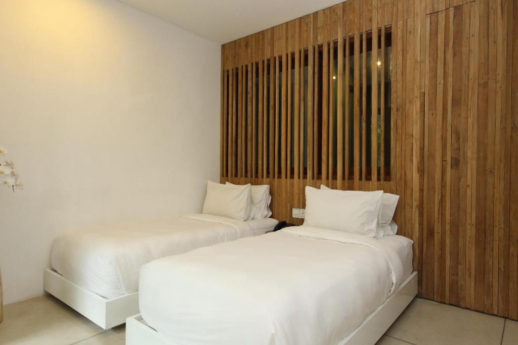 Postel nebo postele na pokoji v ubytování Aria Villas Ubud