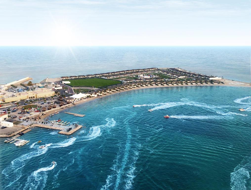 an aerial view of a beach with boats in the water at Dana Beach Resort in Half Moon Bay