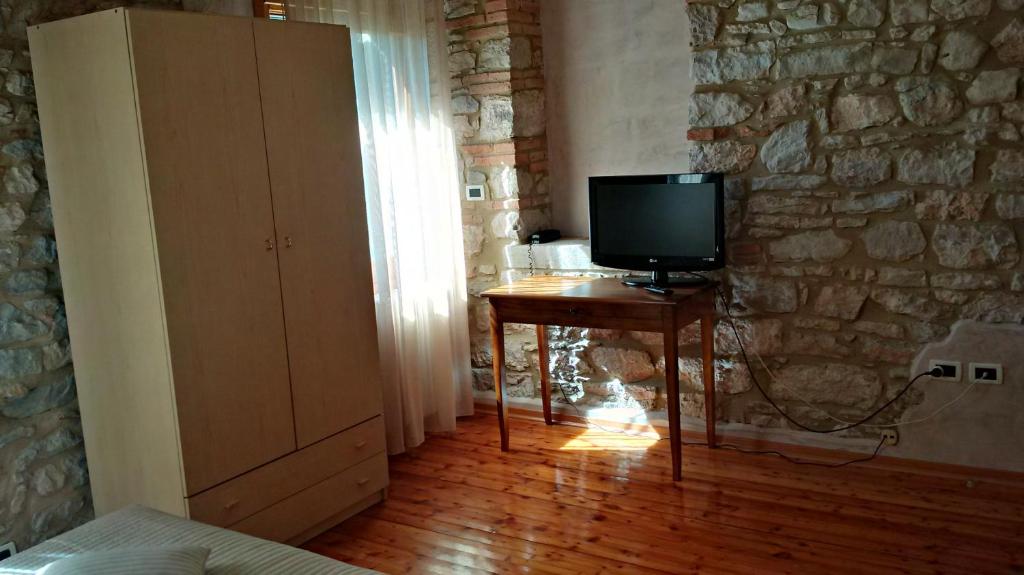 TV a/nebo společenská místnost v ubytování Al Cavallino
