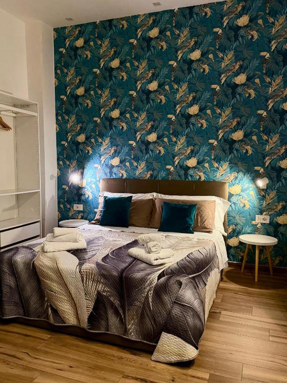 Giường trong phòng chung tại guest house Napul'è
