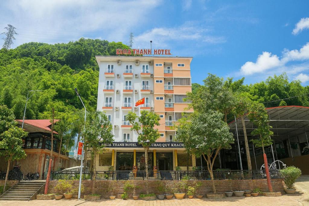 a hotel building with a sign on top of it at Khoa Thanh Hotel in Mai Chau