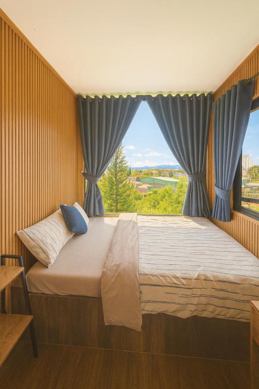 Postel nebo postele na pokoji v ubytování Cao Nguyên Đỏ Homestay - BBQ - Coffee