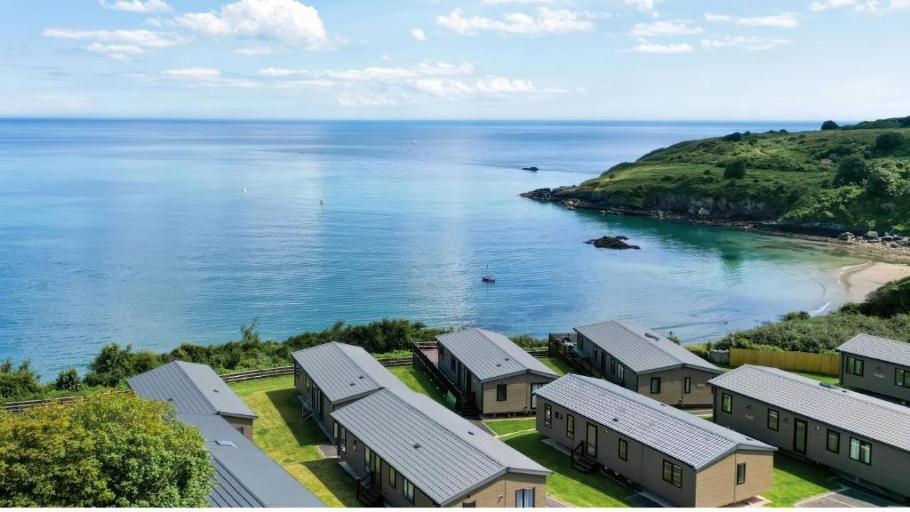 an aerial view of a row of houses next to the ocean at Lodge 65 at Riviera Bay Coastal Retreat in Brixham