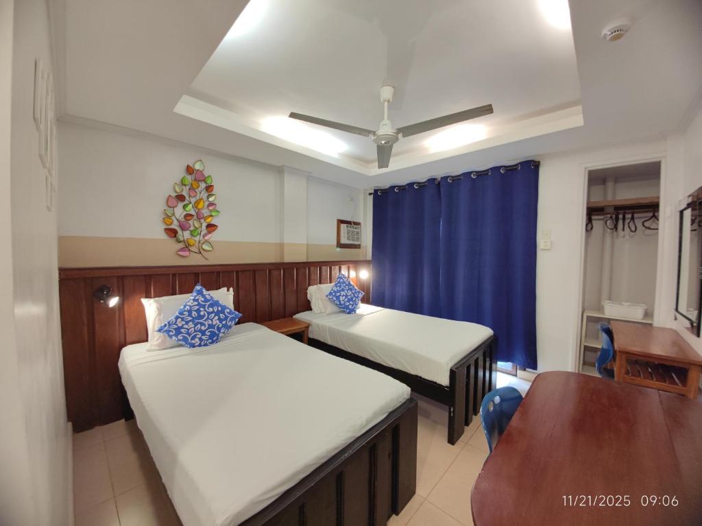 Ένα ή περισσότερα κρεβάτια σε δωμάτιο στο Ferellee Beach Front Inn