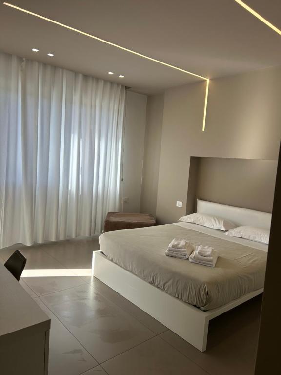 Ένα ή περισσότερα κρεβάτια σε δωμάτιο στο NINFEA sweethome