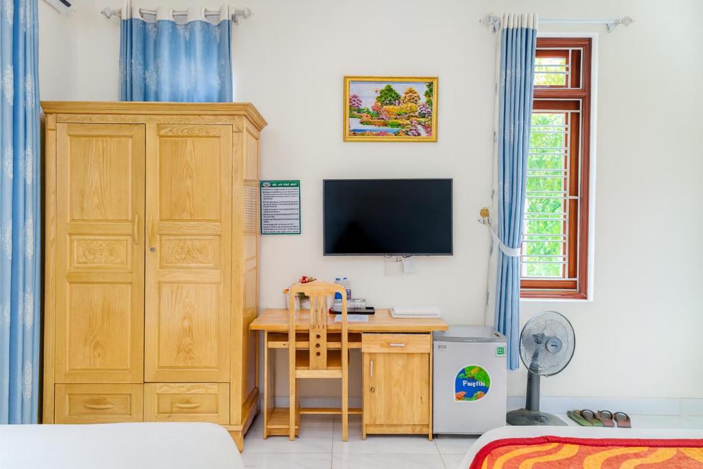 TV a/nebo společenská místnost v ubytování Hồng 68 Motel