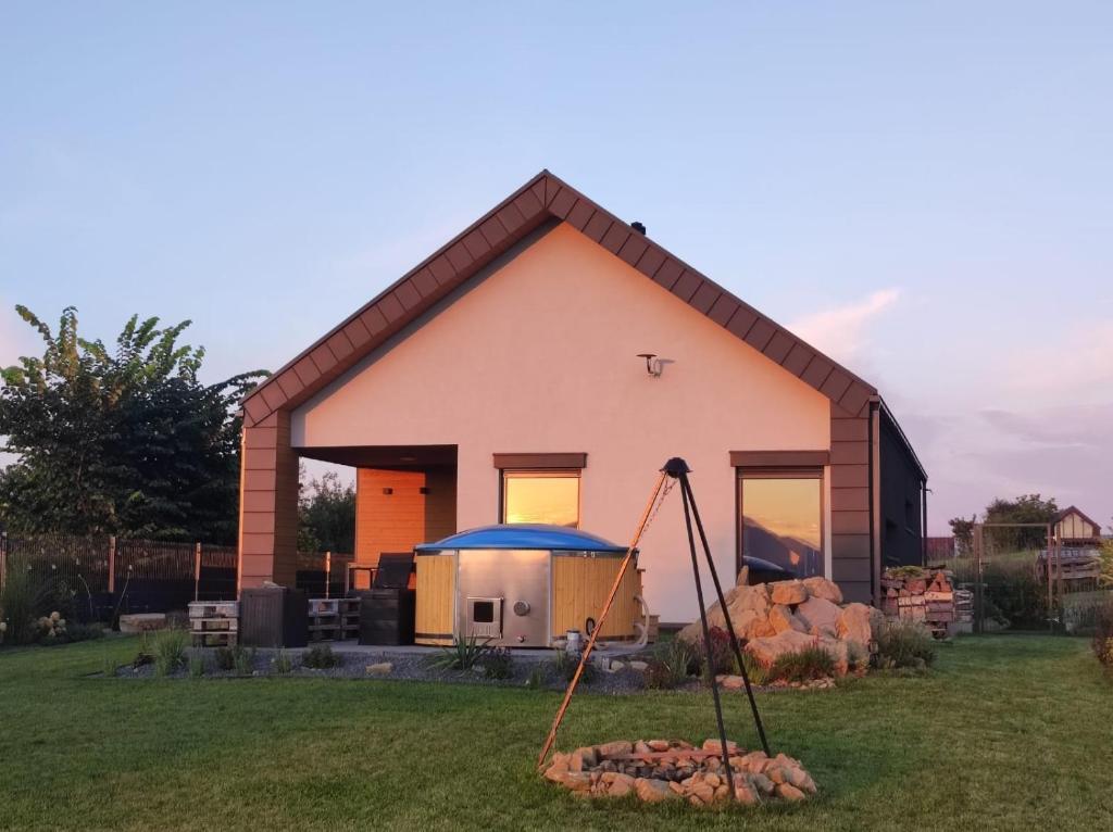a house with a swing in front of it at Villa Panorama in Żywiec